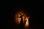 traditional indian dance performance under spotlight